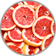 Frisch aufgeschnittene Grapefruit zur Darstellung des herben Zitrusaromas in lebendigen Weißweinen