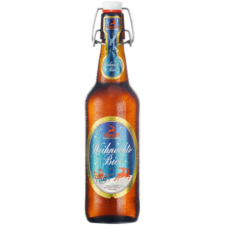 Eine Braunglasflasche der Hirsch Brauerei Weihnachtsbier 20x 0,5 Liter (MEHRWEG) mit festlichem Etikett und Kondenswasser, das diese Wurmlinger Spezialität präsentiert.